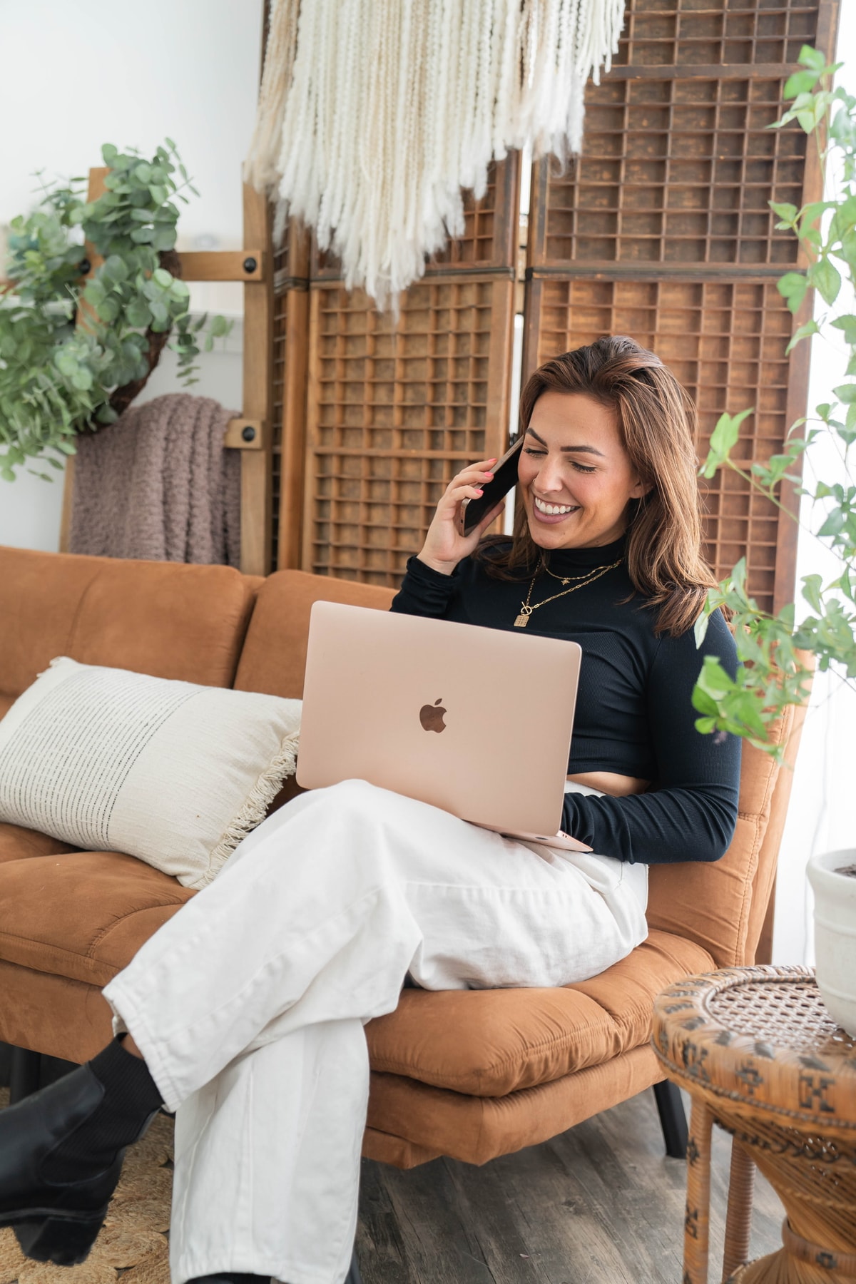 Isabella taking a call with her laptop